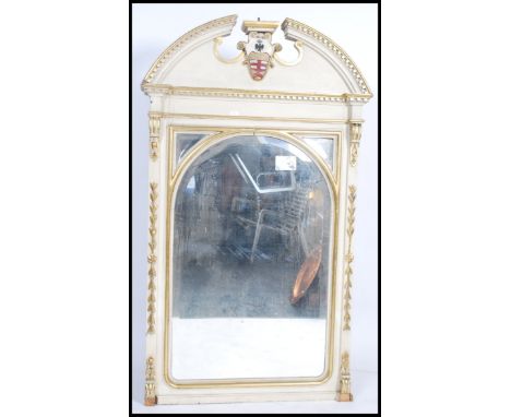 A large over-mantel 19th century painted mirror having a swan neck pediment with a central painted coat of arms, the mirror f