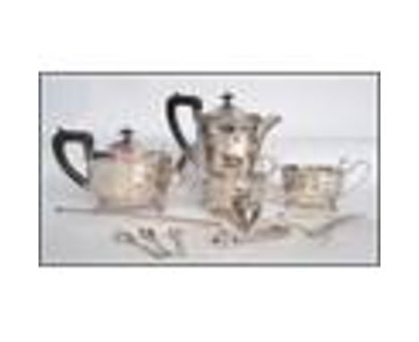 A four piece Sheffield silver plate tea service having ebonised handles along with a collection of silver plated spoons and a