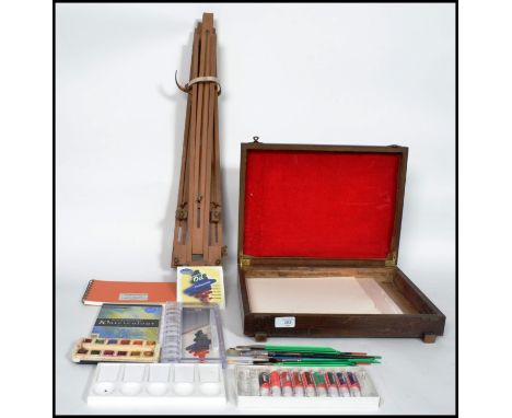 A vintage 20th century metamorphic folding artists easel along with a collection of artist paint and equipment. Please see im
