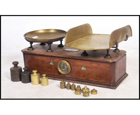 A good 19th century large set of Italian Industrial shop pharmacy scales with brass pans and wooden plinth base with brass no