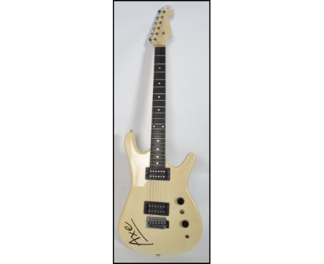 A vintage six sting electric guitar by Axe having a stratocaster type body in white with white pick guard.