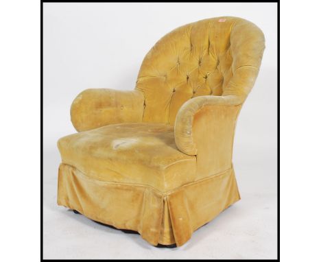 A Victorian Howard style mahogany armchair being button backed with yellow skirt and yellow velour upholstered frame 88x72x80