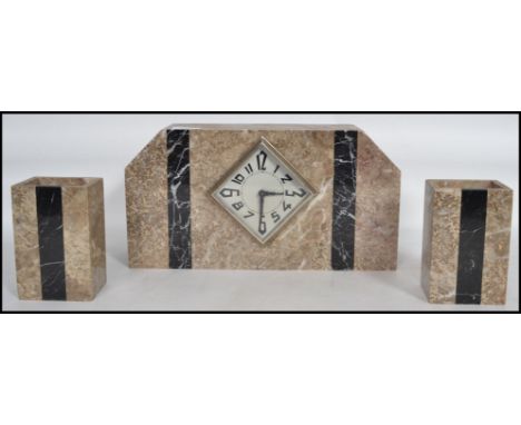 A 1920s Art Deco French marble mantel three piece clock and garniture set of angular form having black marble bands and facet