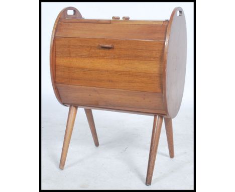 A vintage / retro  20th century work / sewing box. Having twin hinged covers to the top opening to reveal a fully appointed i