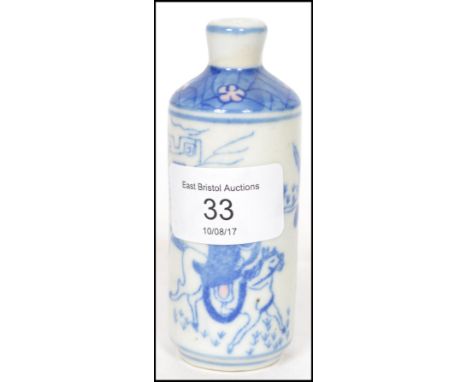 A believed 18th century Ching Dynasty Oriental ceramic scribes ink bottle decorated in blue white and pink depicting scenes o