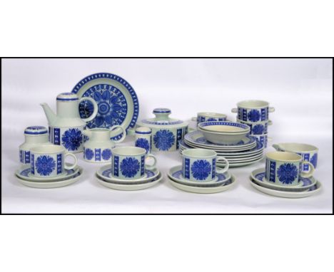 A retro 20th century part dinner and tea service by Midwinter in the Stonehenge pattern finished with hand applied blue decor