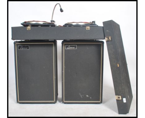 A vintage DJ record deck system and speakers consisting of two Garrard record decks set in a large vinyl box with two tall Li