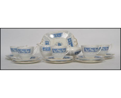 A vintage  Coalport Bone China six person tea service in the Reverly pattern, consisting of trio's, sugar bowl, creamer and s