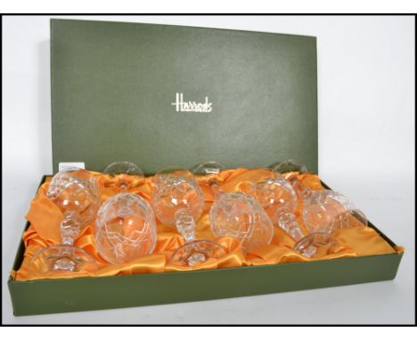 For Harrods of Knightsbridge, a set of 6 lead cut crystal sherry / wine glasses raised on a hexagonal sectioned circular base