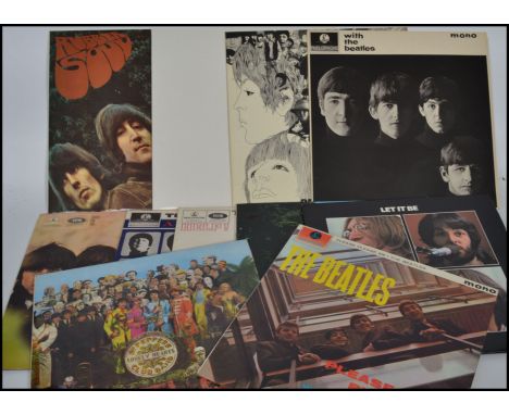 A fantastic collection of vinyl long play records by the Beatles to include Please please Me, Revolver, Rubber Soul, The Whit