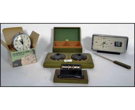 A collection of vintage retro 20th century items to include a retro alarm clock with a full front date dial, desk tidy etc pl