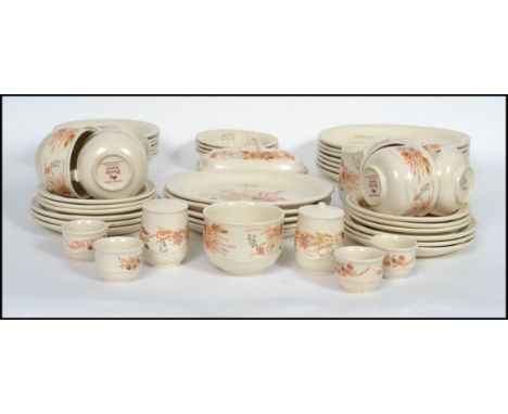An extensive Poole Pottery ' Summer Glory ' pattern dinner and tea service. The set comprising dinner plates dinner bowls, cu