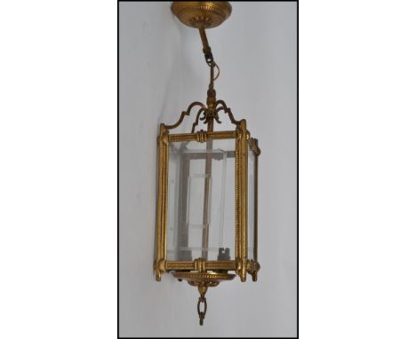 An early / mid century 20th century Empire style porch lantern having acid etched panels with swag style arches atop, twin bu