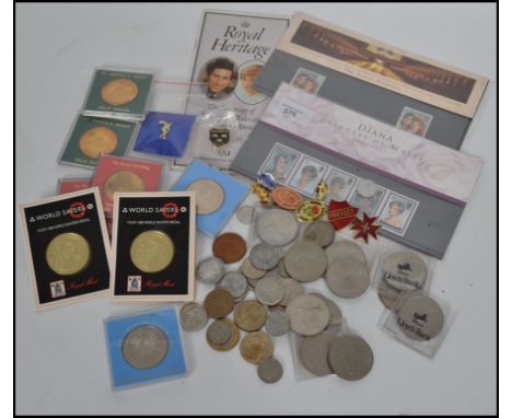 A collection of items to include vintage coins, enamel badges, stamps etc please see images.