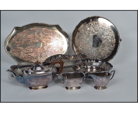 A vintage 20th century silver plated tea service together with a selection of silver plated trays, some with gallery edges.