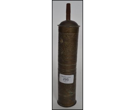 An unusual 20th century Persian / Islamic believed coffee grinder of cylindrical form having opening sections with Islamic sy