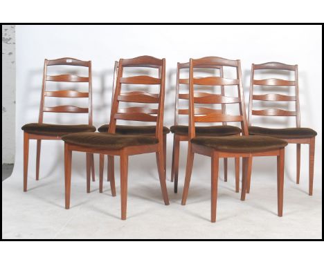 A set of six G Plan teak wood ladder back dining chairs, raised on tapering legs united by stretchers with stuffed brown velo