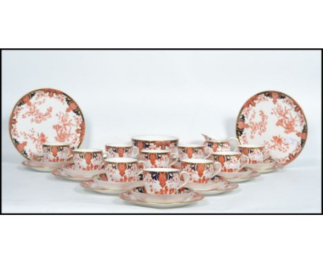 A good Royal Crown Derby Imari pattern tea service comprising cups, saucers, plates, sandwich plates, sugar bowl, creamer etc