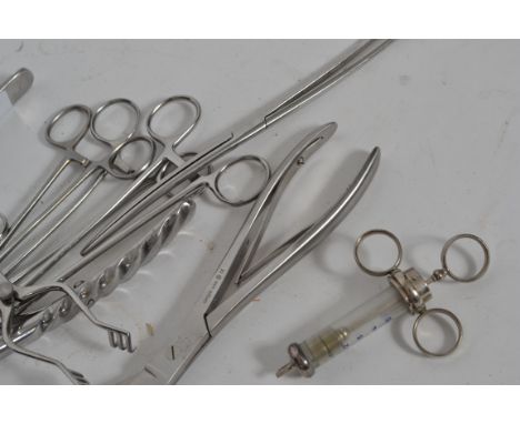 A collection of vintage medical doctors surgical operation tools to include syringes, bone cutters, scissors etc. Please see 