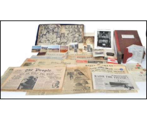 A collection of mixed 20th century ephemera to include two vintage 20th century scrap books, postcards, bible, Victorian news