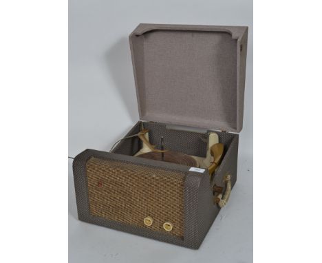 A vintage 20th BSR record player set in a two tone vinyl case with grille and dials to front.