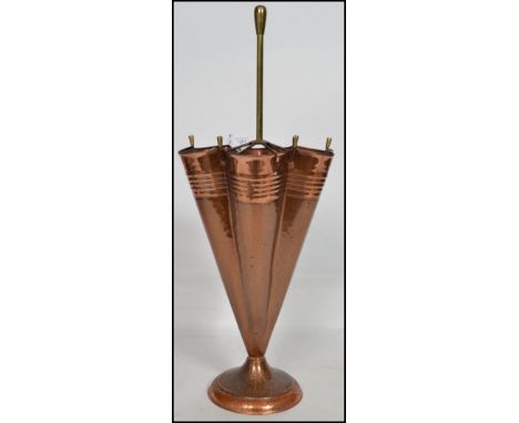 A vintage 20th century copper and brass umbrella shaped stand in the form of an upturned umbrella, with handle to centre