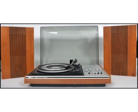 A stunning  vintage retro ITT KB twelve fifty stereo  Record Player with a pair of matching teak speakers. 