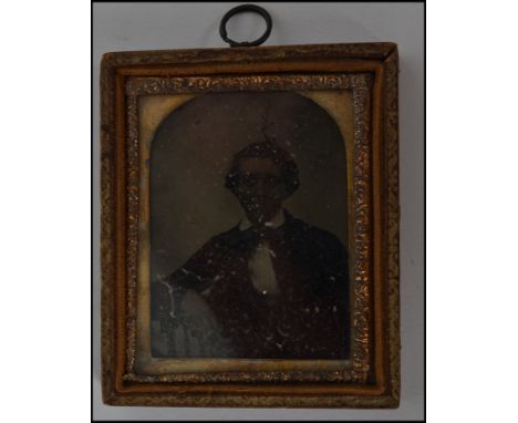 A 19th Victorian  Ambrotype photograph portrait study of a young man set in a gilt frame.