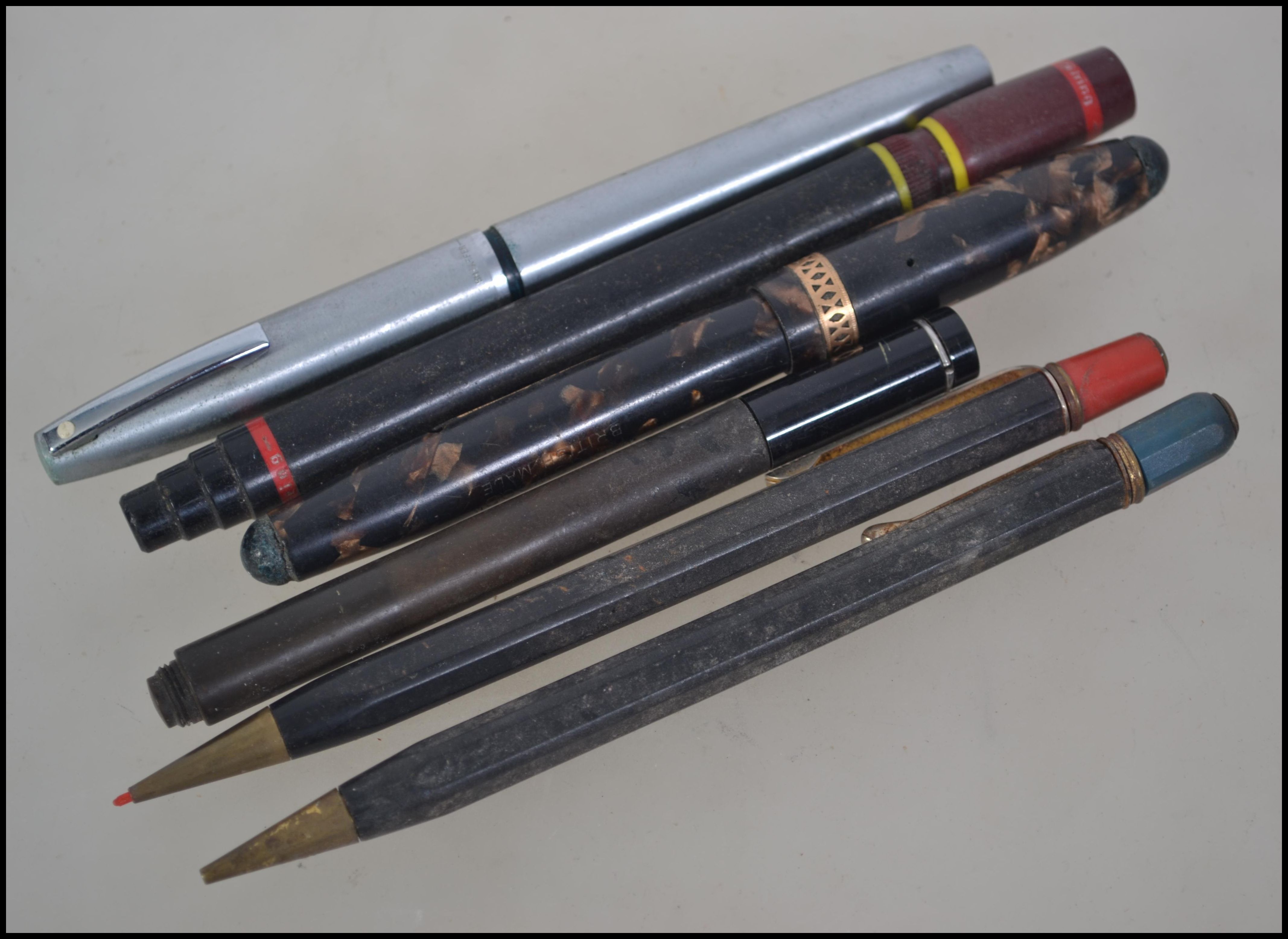 A collection of vintage 20th century pens and propelling pencils with