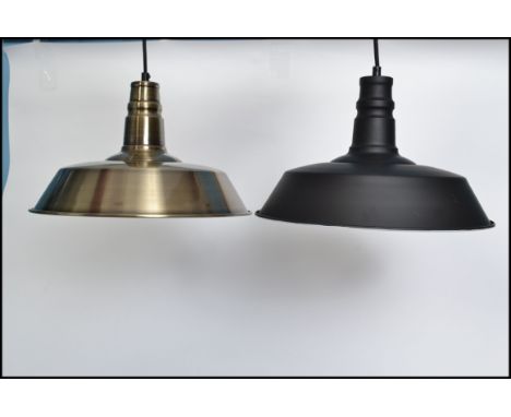 2 retro / vintage industrial style factory pendant of enamel metal in the UFO style. one with black and white colourway, the 