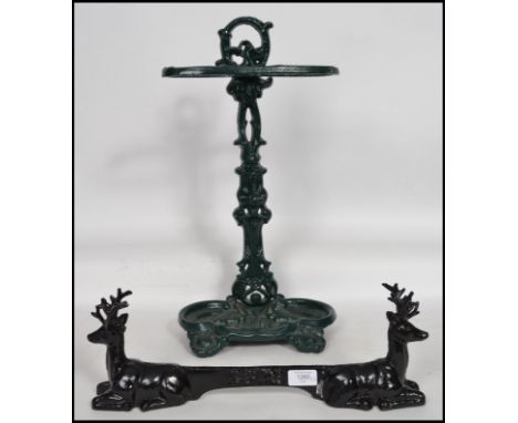 A Coalbrookdale style cast metal painted umbrella stand together with a cast metal boot scrap being ebonised with deer / stag