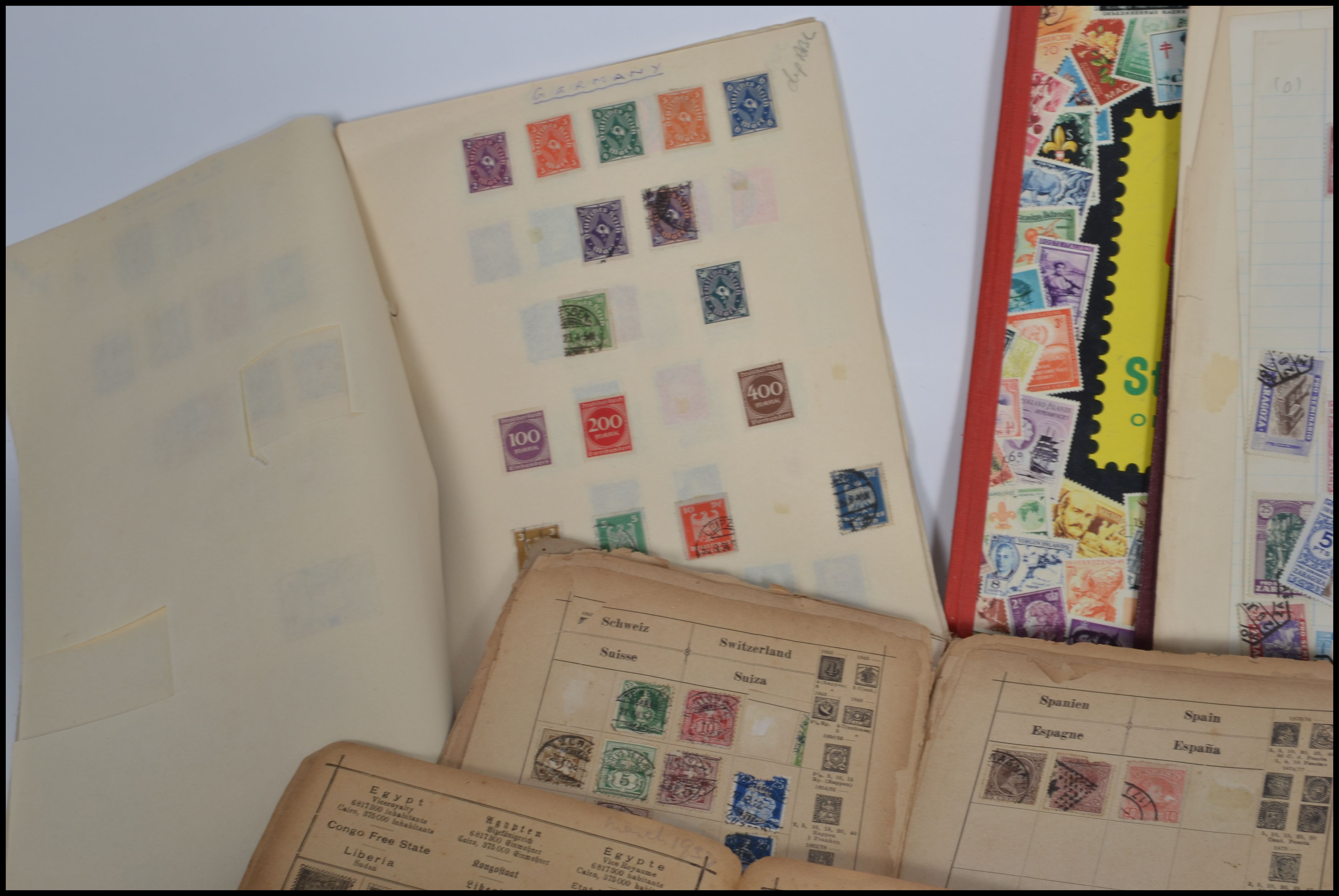 A collection of vintage philatelic stamps mostly held within albums to