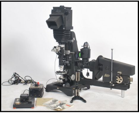 An unusual 1950s German Leitz very large photo microscope of ebonised metal construction with camera holder with bellows and 