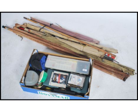 A large collection of vintage and retro fishing equipment to include cane and fibre fishing rods ( Sea, course and fly  fishi