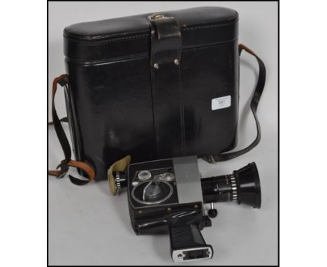 A vintage Bollet Paillard P4 Swiss Cine automatic camera in original black leather fitted case.