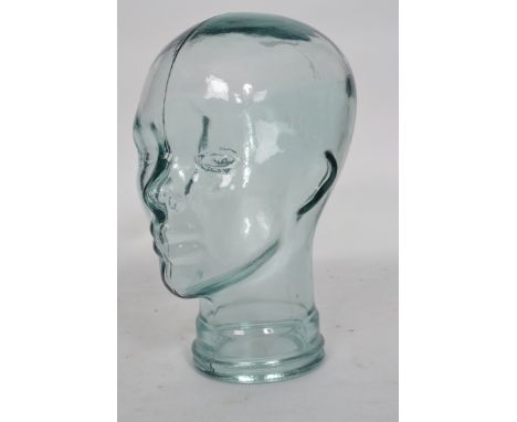An unusual 20th century &nbsp;coloured glass head - bust used for shop display Haberdashery stand. Measures 33cm high.&nbsp;