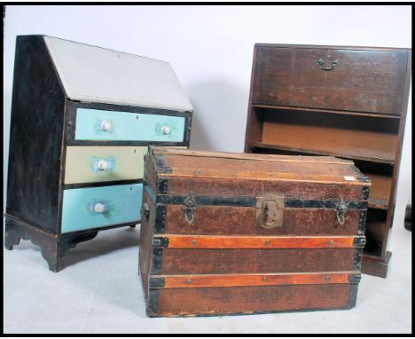 A 19th century wooden and canvas bound dome top steamer trunk together with a 1920's oak student bureau and a shabby chic pai