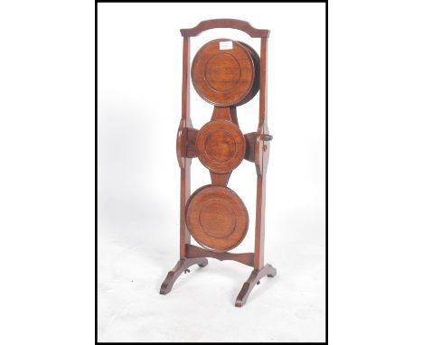 A 1920's solid mahogany 4 tier metamorphic cake stand in the manner of 'monoplane' with plaque for fyne ladye furniture