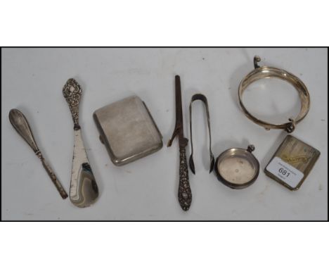 A collection of hallmarked silver and silver plated items to include a silver pocket watch case, silver stand, match vesta, S