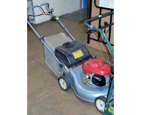 A HONDA ENGINE LAWNMOWER    