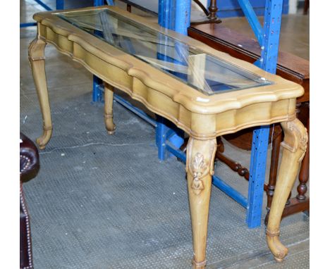 A GLASS TOP CONSOLE TABLE    