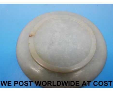 A small Chinese jade snuff dish of spinach type, probably 18thC (11cm diameter) 