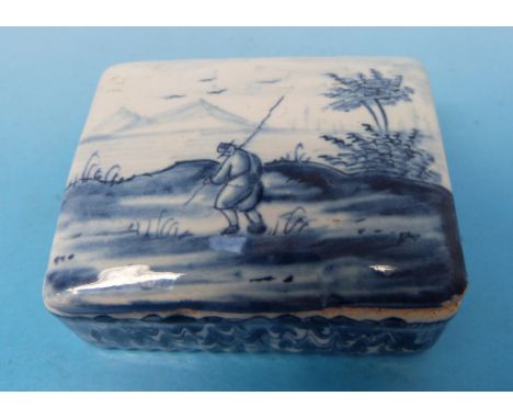 A Delft blue and white patch box decorated with landscape scene with figure, monogrammed to underside HL (6cm long)