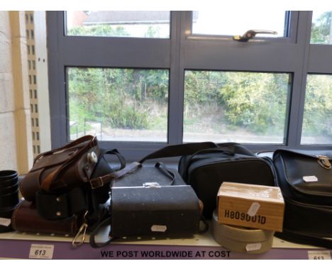 A collection of cameras including Nikon and Polaroid 635 Supercolour