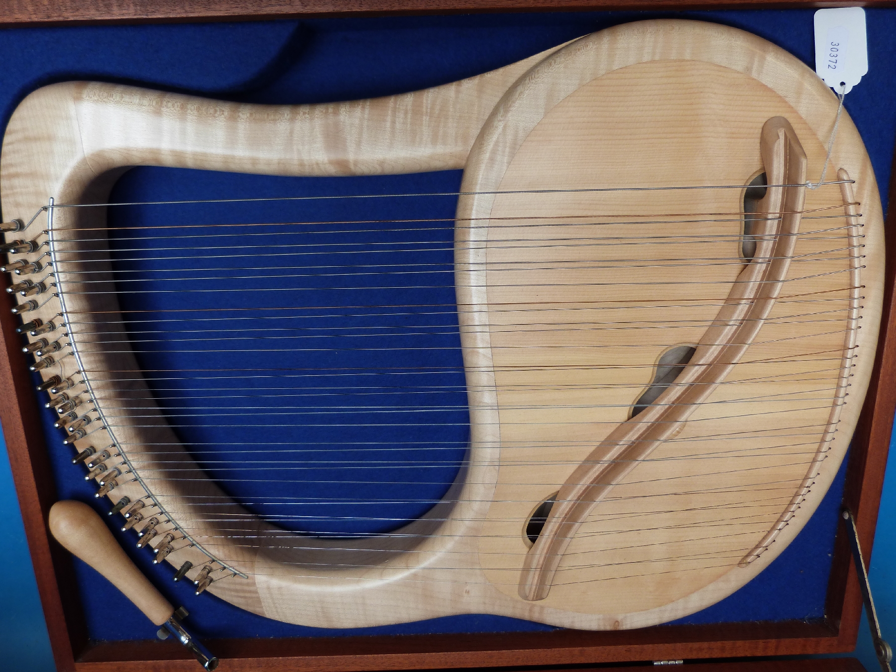 A cased fully chromatic 35 string soprano lyre in sycamore by Sophia