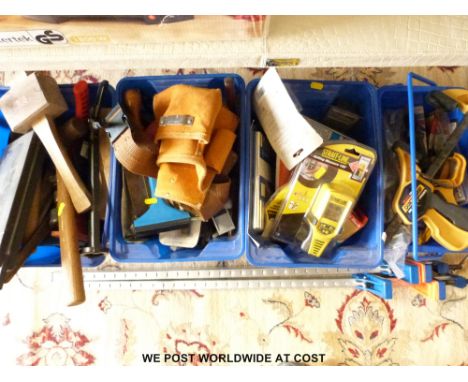 Four blue boxes of tools and DIY accessories, some unopened 