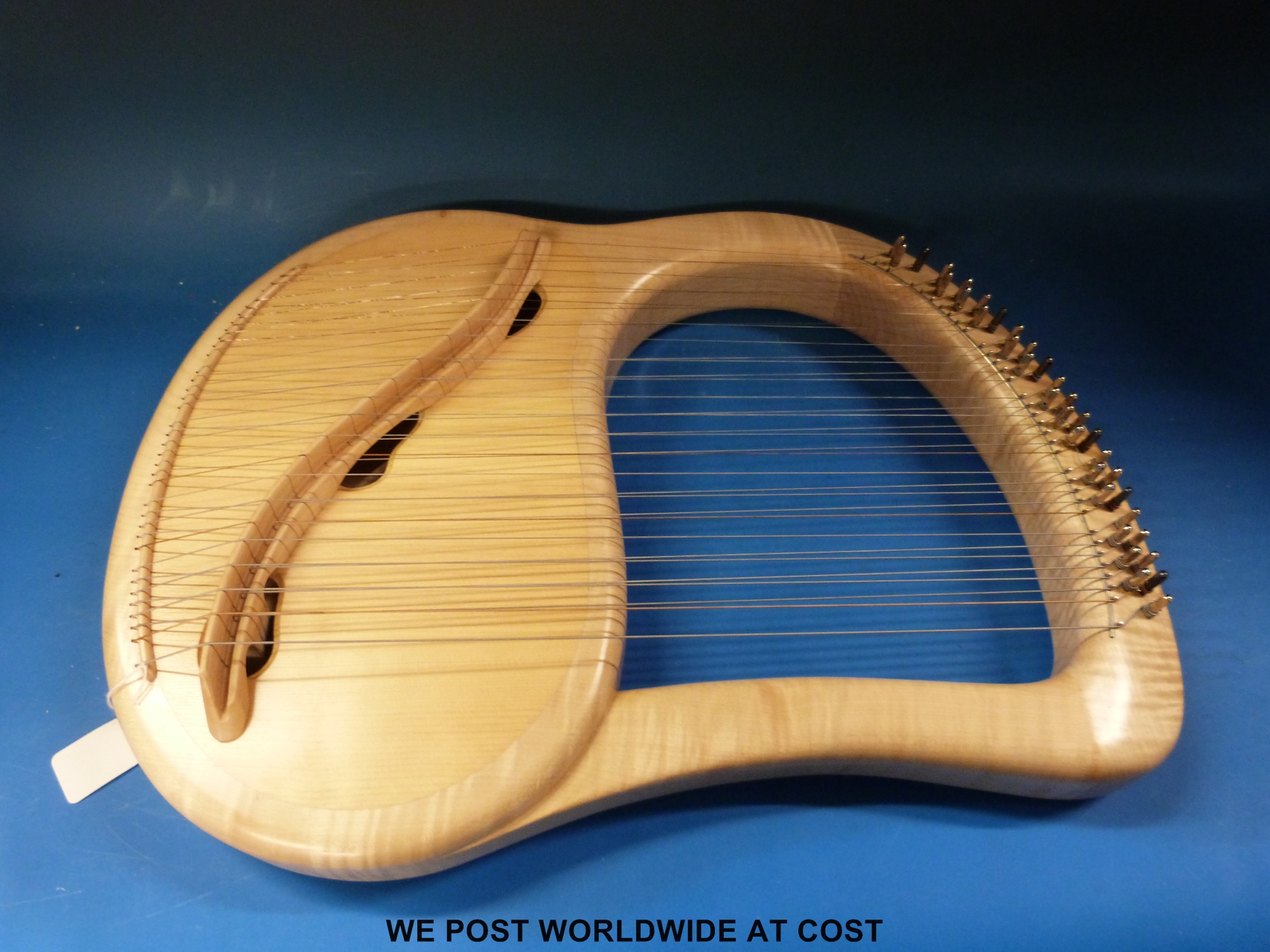 A cased fully chromatic 35 string soprano lyre in sycamore by Sophia