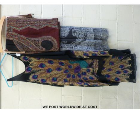 Hand-made woollen shawls and a dress with peacock print by Sora Couture 