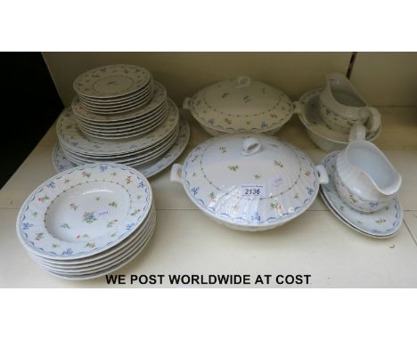 A six setting Royal Worcester dinner service in Ribbons and Bows pattern including meat dish, tureens etc 