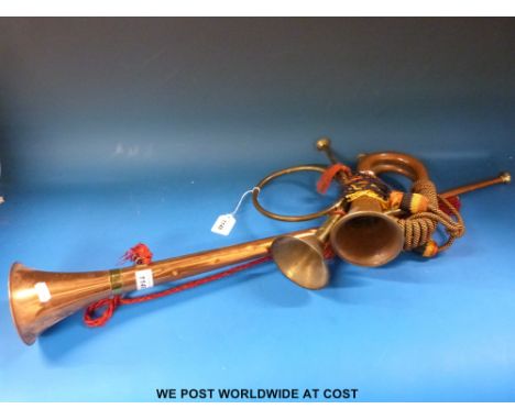 A bugle with lanyard cord together with a coaching horn and one other